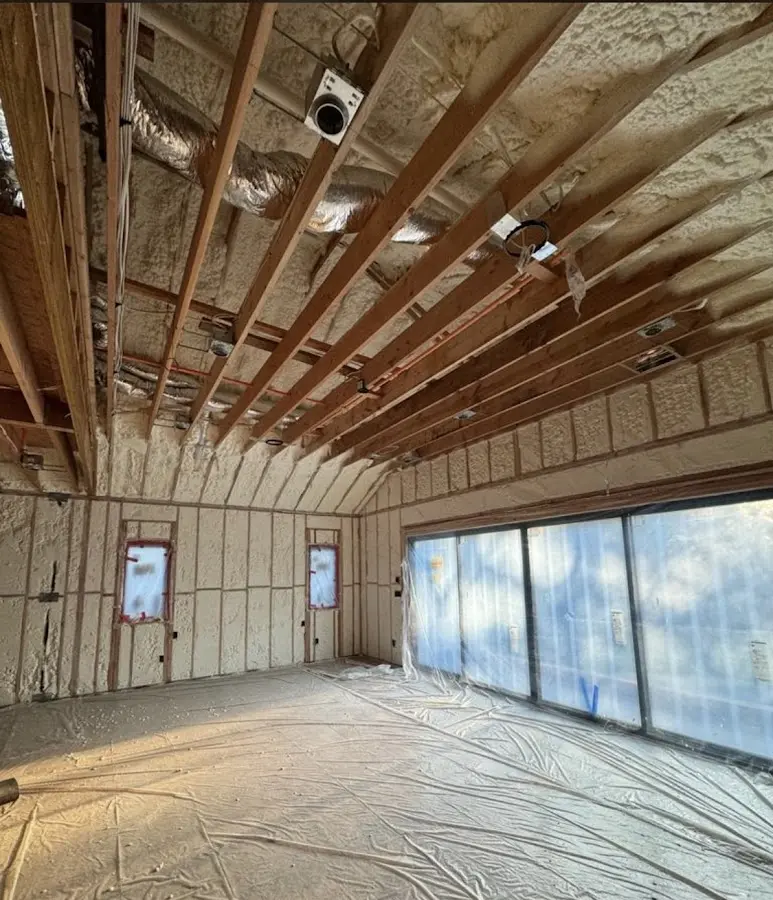Interior walls and ceiling insulated with spray foam during new construction in Coffeyville